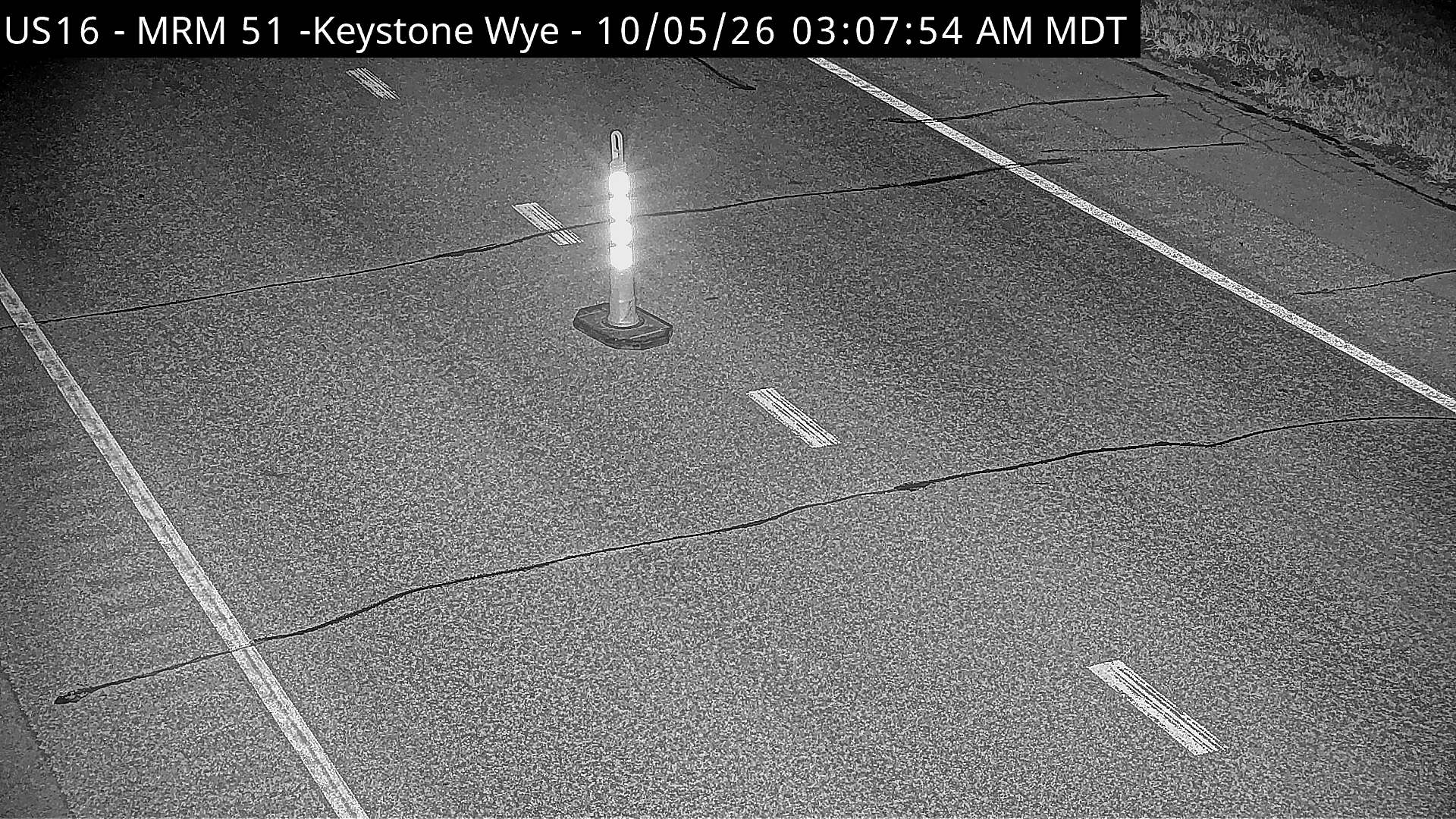 Keystone - north of town along US-16 @ MP 51 WB road zoom (road surface) live camera view